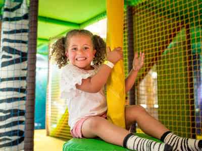 Girl sitting on Soft Play