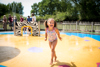 Girl running through Wet 'n' Wild - July 2018