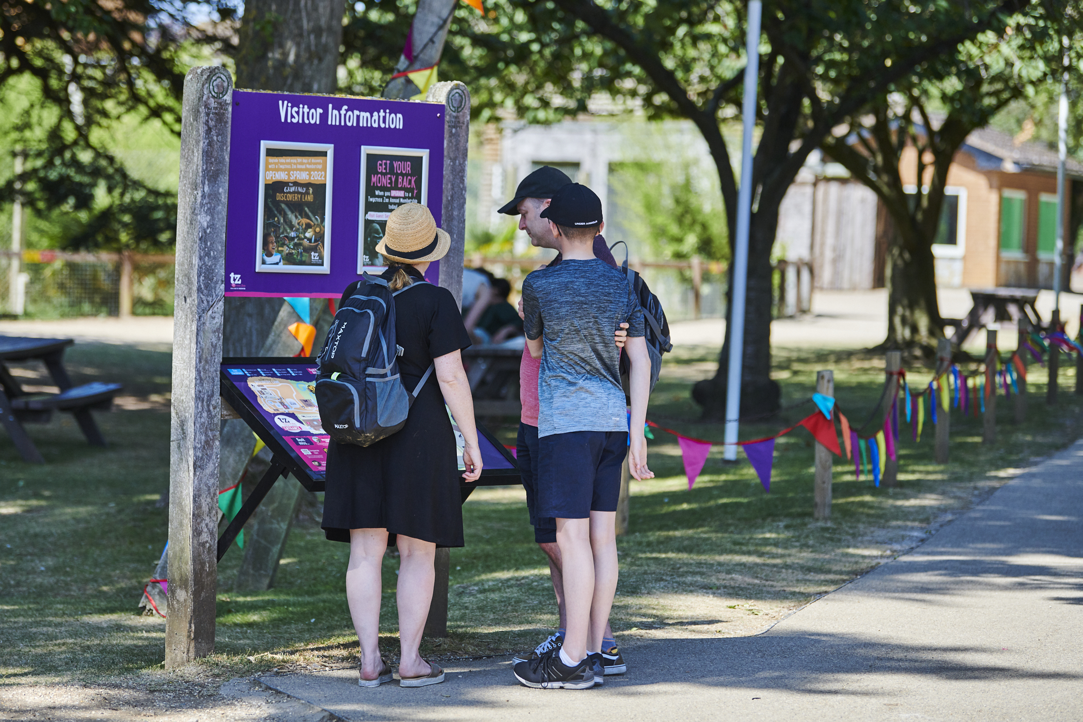 Family look at zoo map