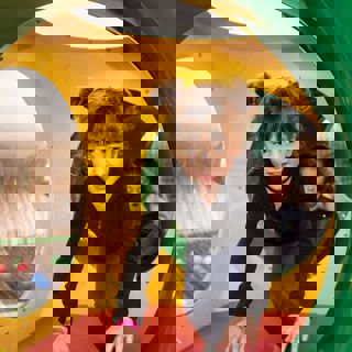 Girls climbing through tunnel on Soft Play