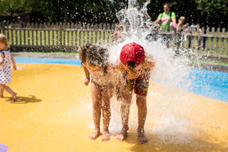 Boy and girl get splashed by water on Wet 'n' Wild - July 2018