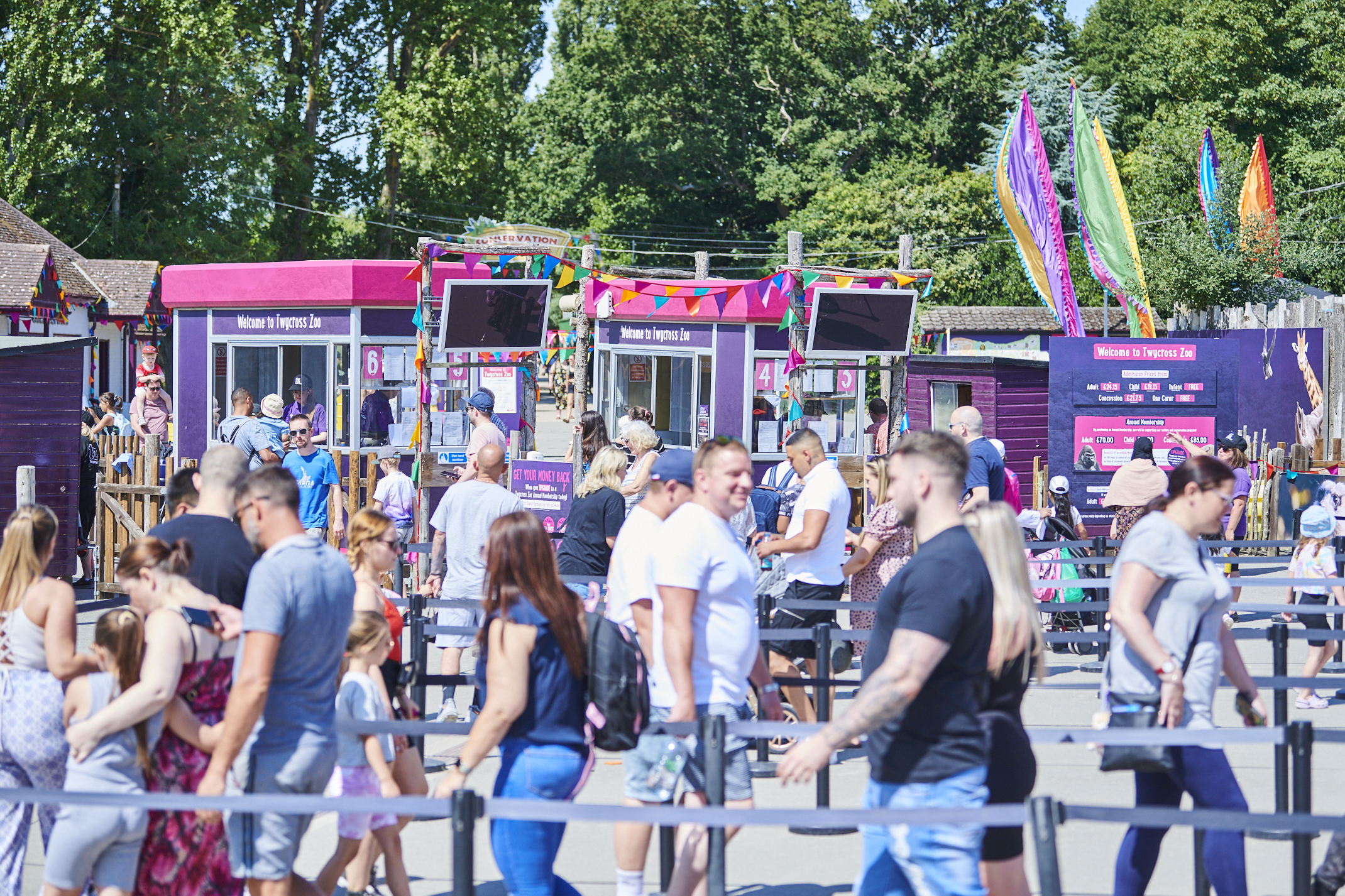 Visitors queuing at ticket kiosks