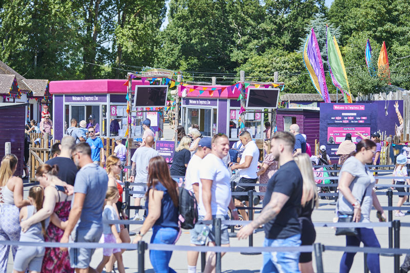 Visitors queuing at ticket kiosks